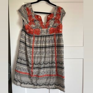 Black and cream dress with orange embroidery